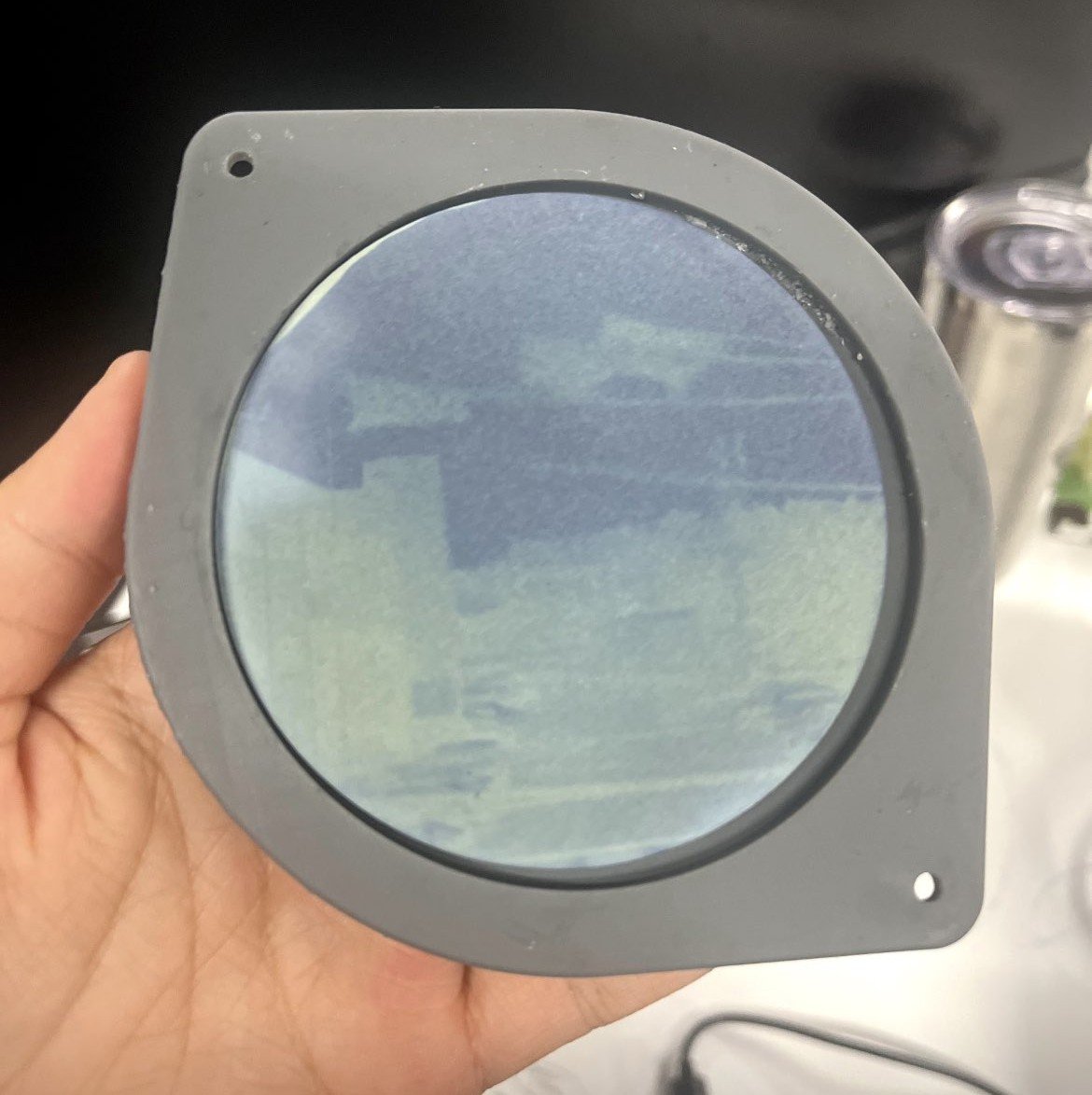 A lens disc held in a hand