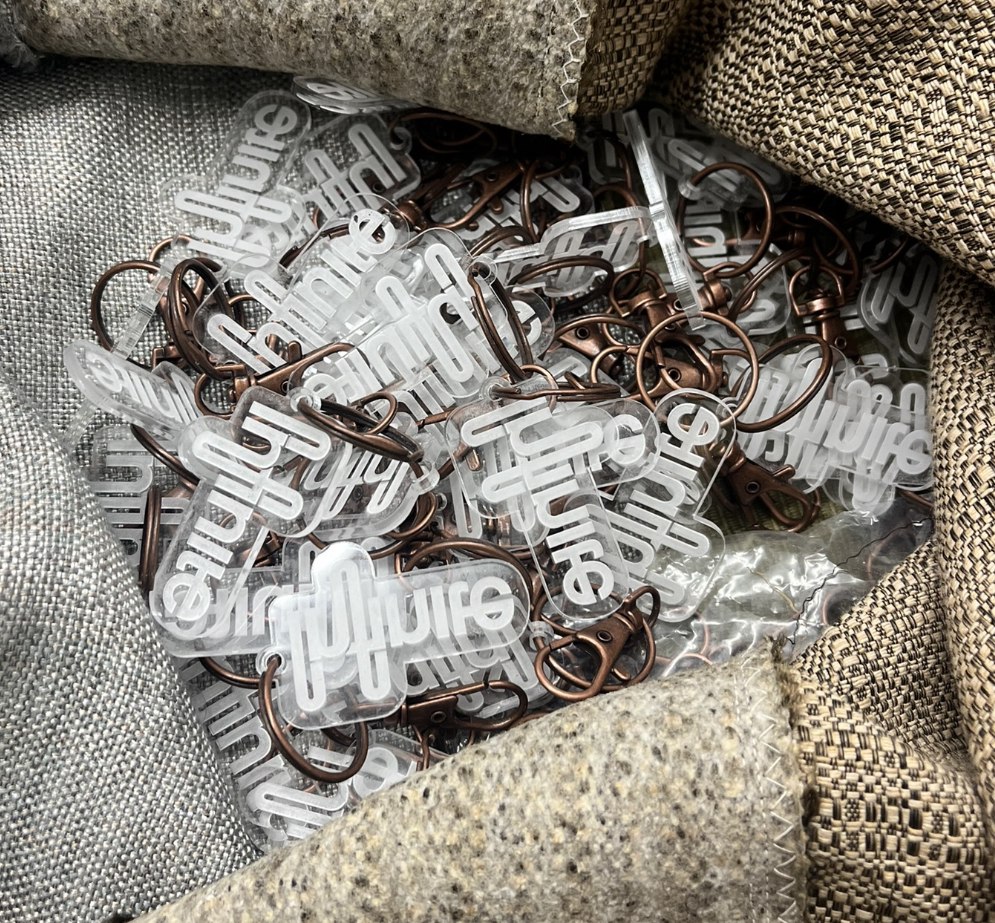 A bag of clear acrylic keychains